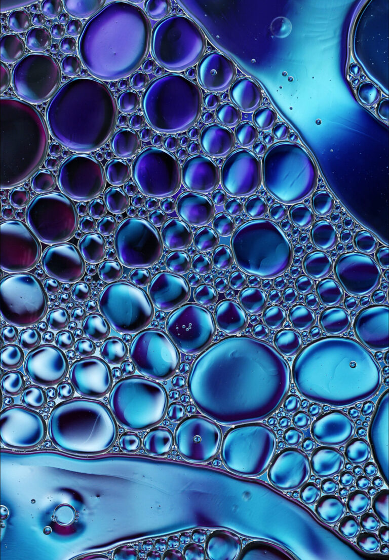 Abstract Colorful Food Oil Drops Bubbles and spheres Flowing on Water Surface